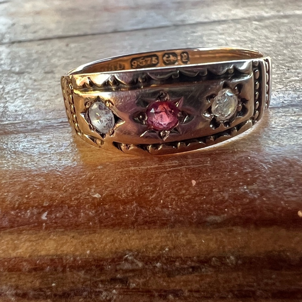 9k gold diamonds and ruby gypsy ring with lots of hallmarks